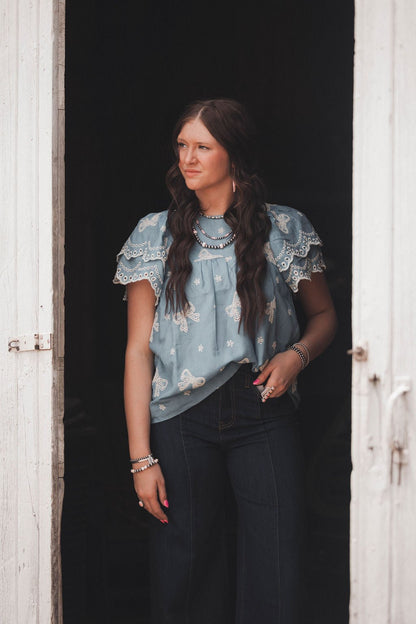Umgee "All Tied Up" Bow Embroidered Denim Chambray Western Top — Scalloped Ruffle Sleeves Summer Charm (Medium remaining)