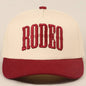 "RODEO" Two-Tone Embroidered Trucker Hat — Wine Red Cotton Canvas with Raised Lettering & 5-Panel Structure